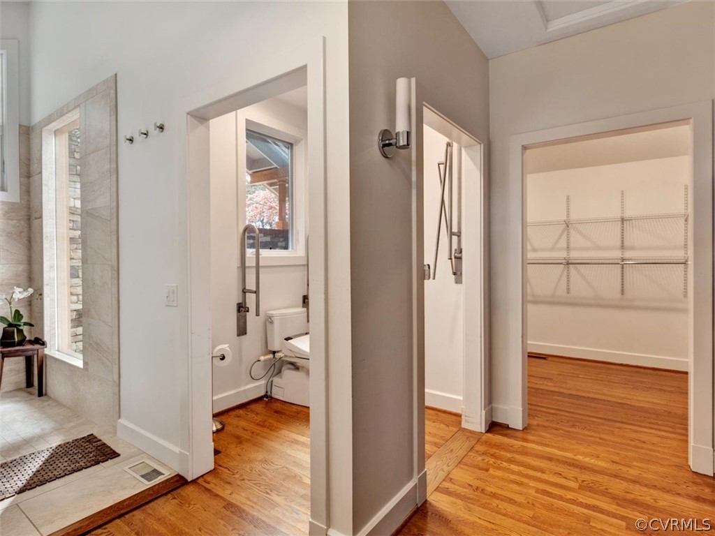 8010 Thom Road Henrico, VA 23229 - Photo 30 of 50 a view of bathroom with a tub shower and hardwood floor