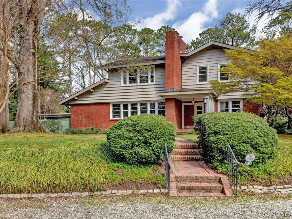 8010 Thom Road Henrico, VA 23229 - Photo 3 of 50 a front view of a house with a yard