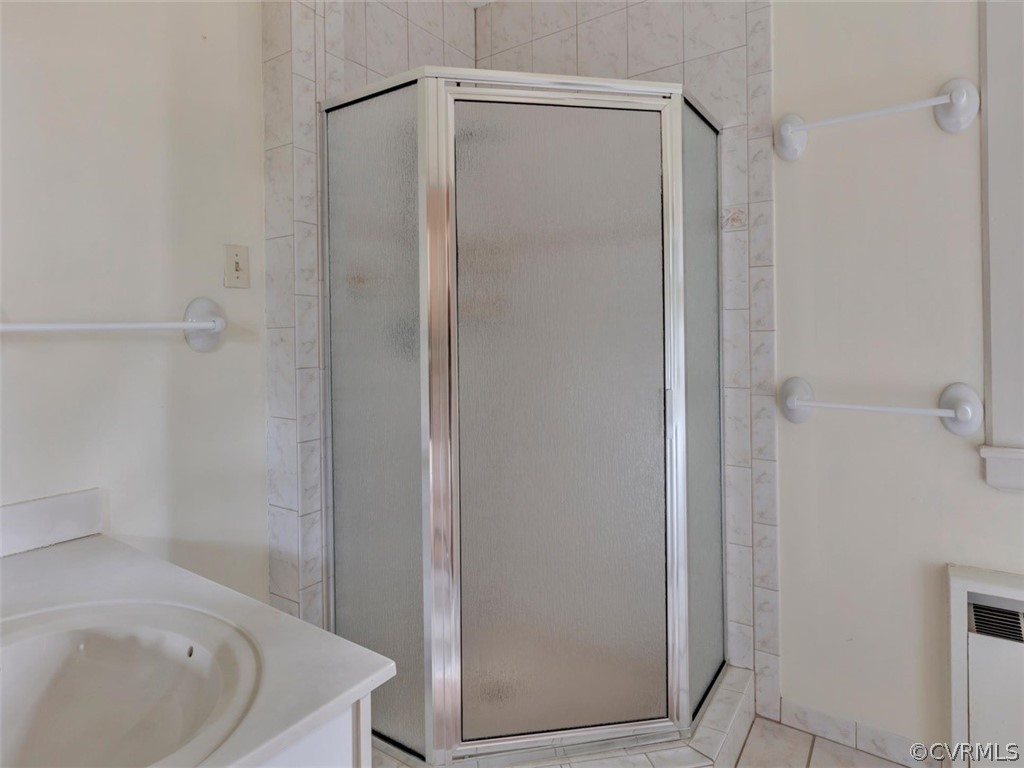 8010 Thom Road Henrico, VA 23229 - Photo 33 of 50 a bathroom with a bathtub and a shower