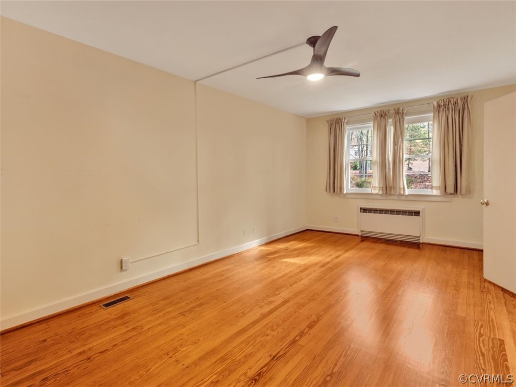 8010 Thom Road Henrico, VA 23229 - Photo 36 of 50 an empty room with wooden floor and windows