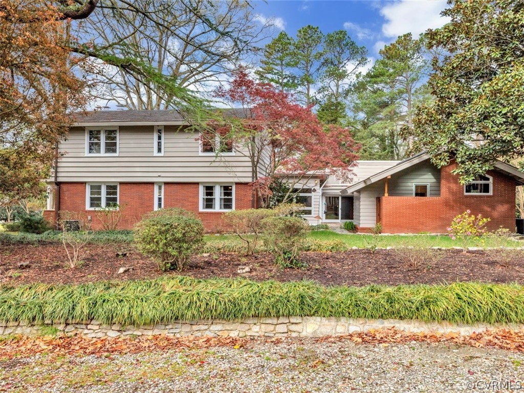 8010 Thom Road Henrico, VA 23229 - Photo 43 of 50 a front view of a house with a garden and tree