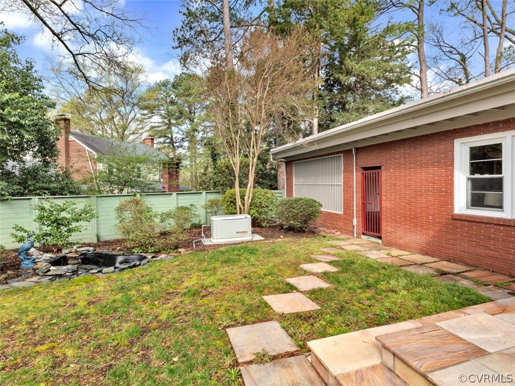 8010 Thom Road Henrico, VA 23229 - Photo 45 of 50 a view of a house with backyard and sitting area
