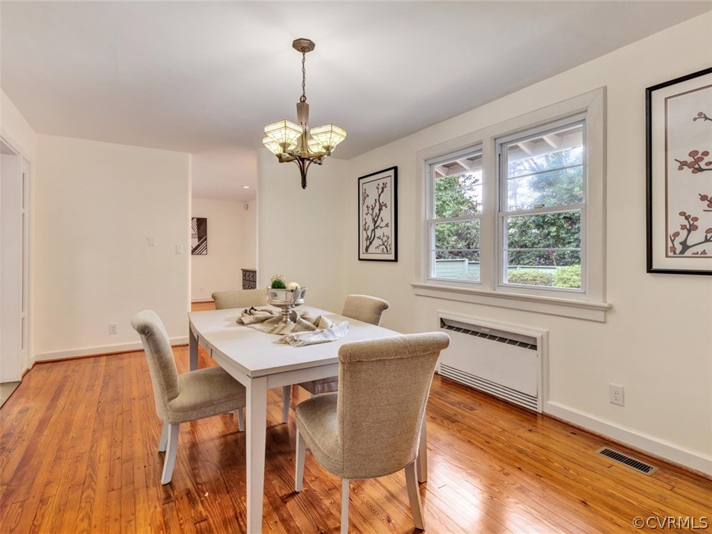 8010 Thom Road Henrico, VA 23229 - Photo 9 of 50 a view of a dining room with furniture wooden floor and chandelier