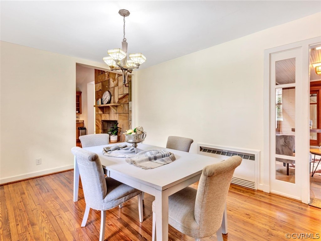 8010 Thom Road Henrico, VA 23229 - Photo 10 of 50 a view of a dining room with furniture wooden floor and chandelier