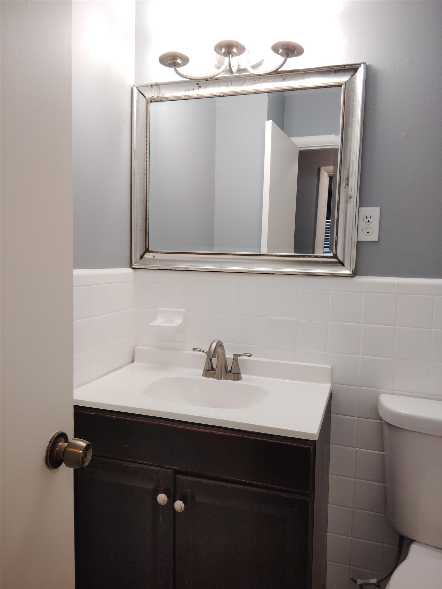 4307 Sidney Road Memphis, TN 38116 - Photo 11 of 18 Bathroom with vanity, tile walls, and a wainscoted wall