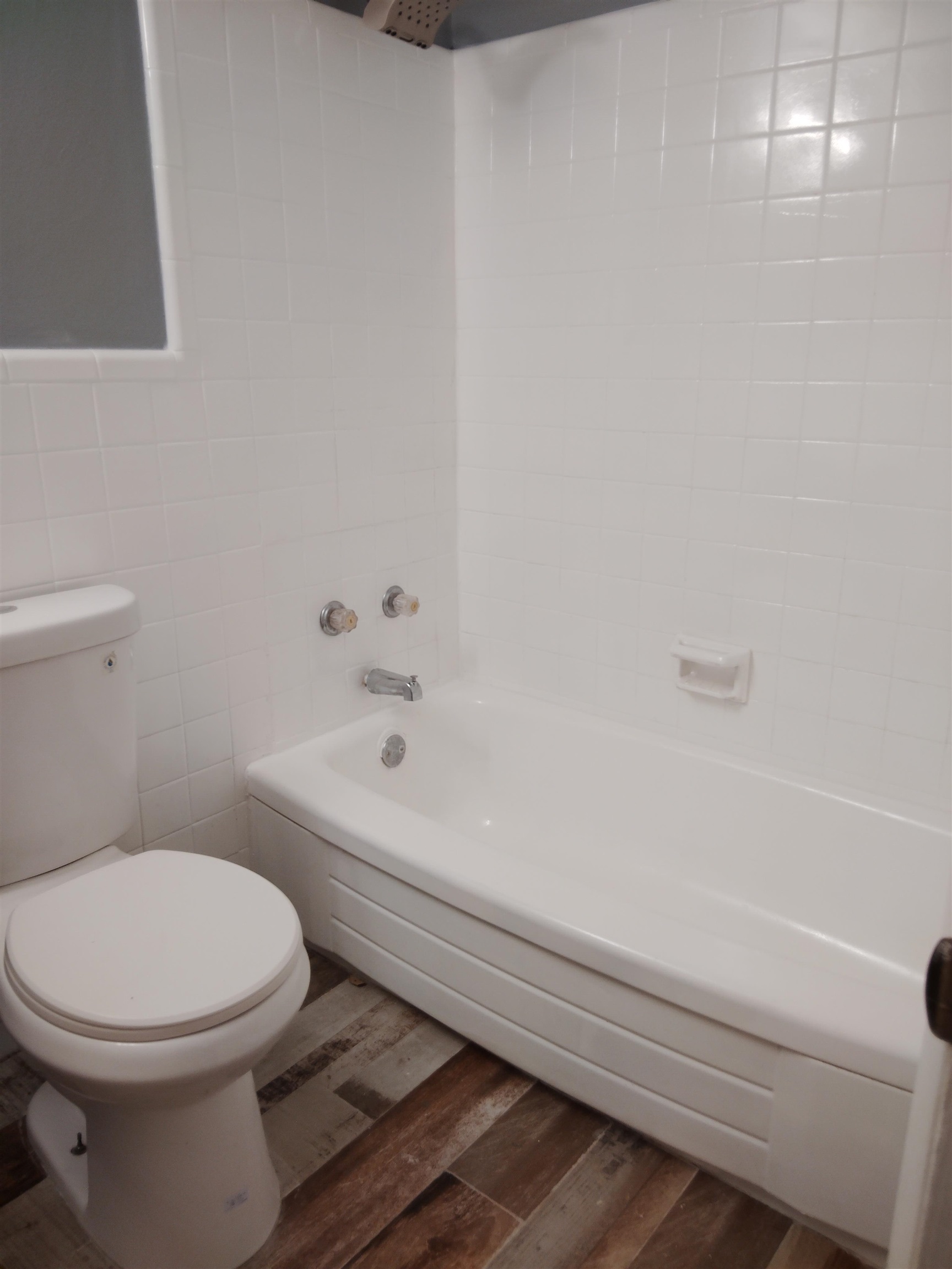 4307 Sidney Road Memphis, TN 38116 - Photo 12 of 18 Full bath featuring dark wood finished floors, bathing tub / shower combination, and tile walls