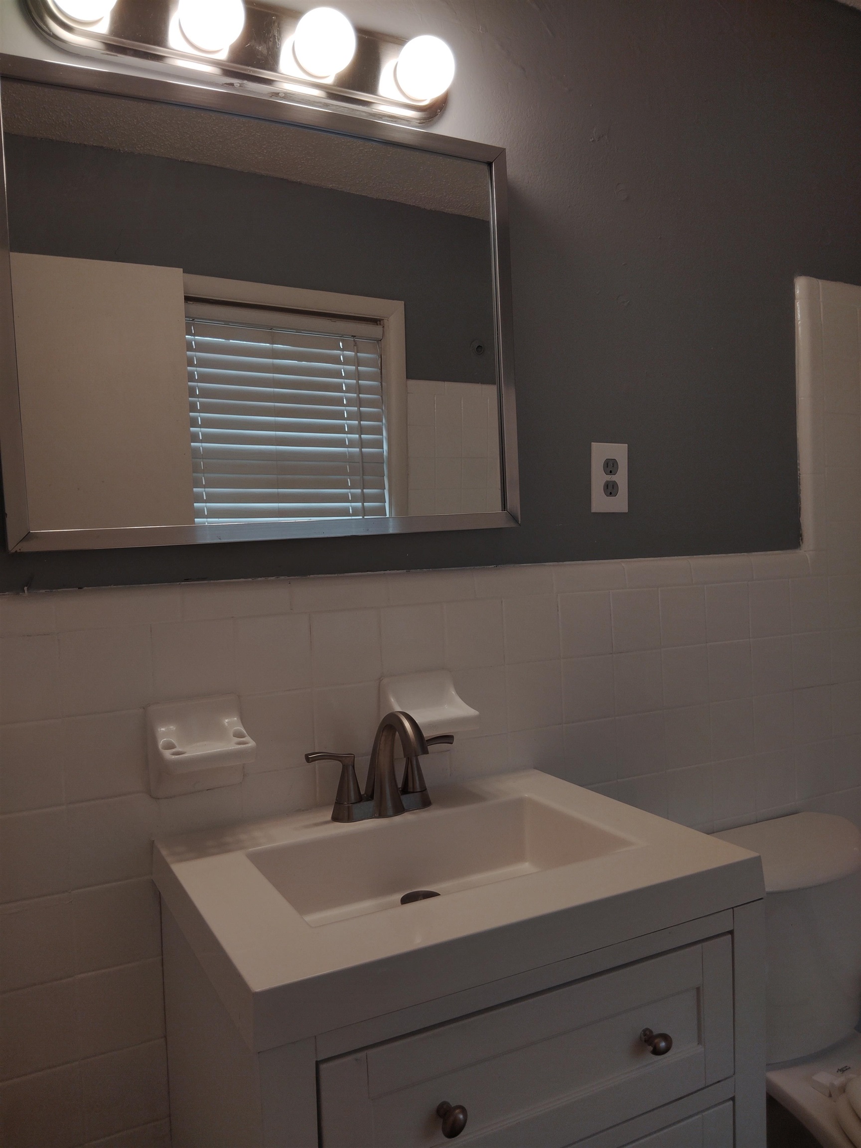 4307 Sidney Road Memphis, TN 38116 - Photo 13 of 18 Bathroom featuring tile walls and vanity