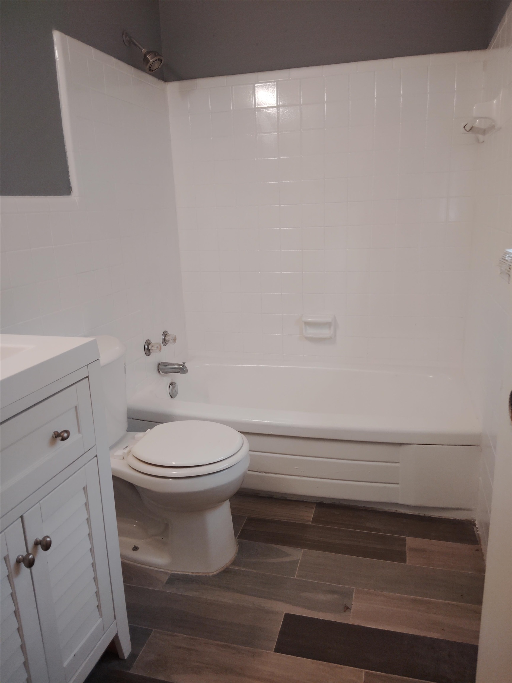 4307 Sidney Road Memphis, TN 38116 - Photo 14 of 18 Full bath with shower / bathtub combination, wood tiled floors, vanity, and tile walls
