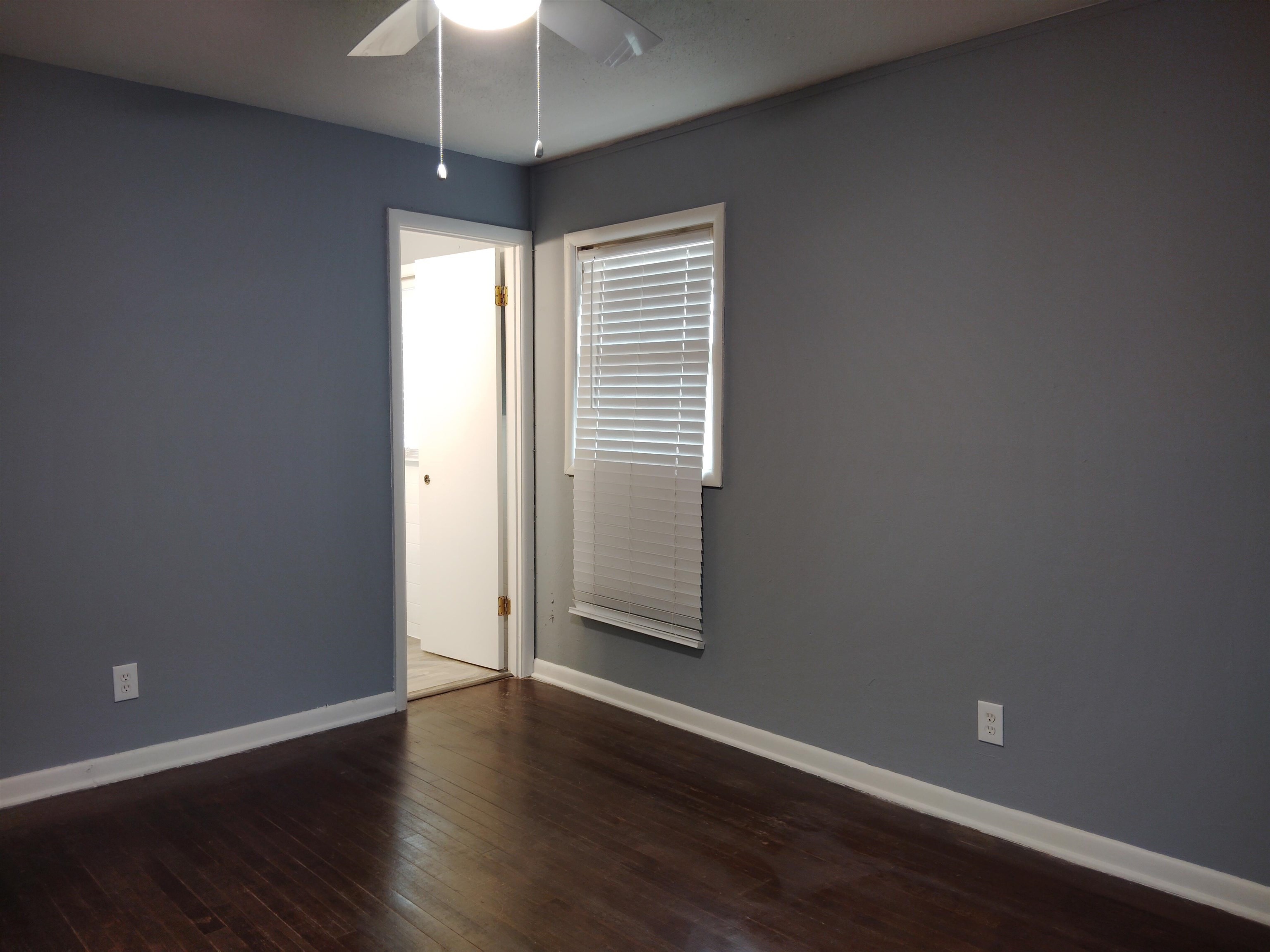 4307 Sidney Road Memphis, TN 38116 - Photo 15 of 18 Unfurnished room with dark wood-type flooring and a ceiling fan