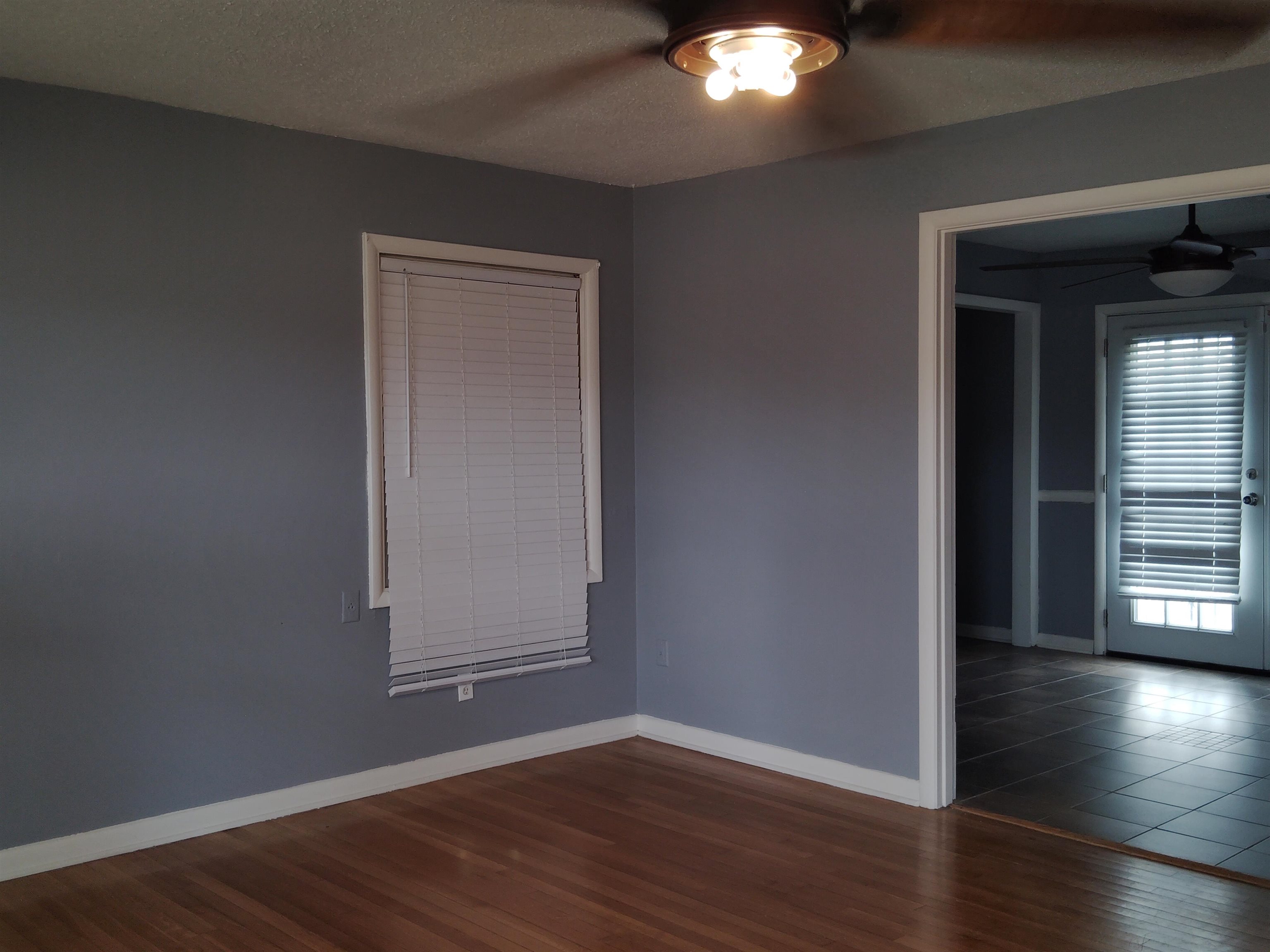 4307 Sidney Road Memphis, TN 38116 - Photo 4 of 18 Unfurnished room featuring dark wood-style floors and a textured ceiling