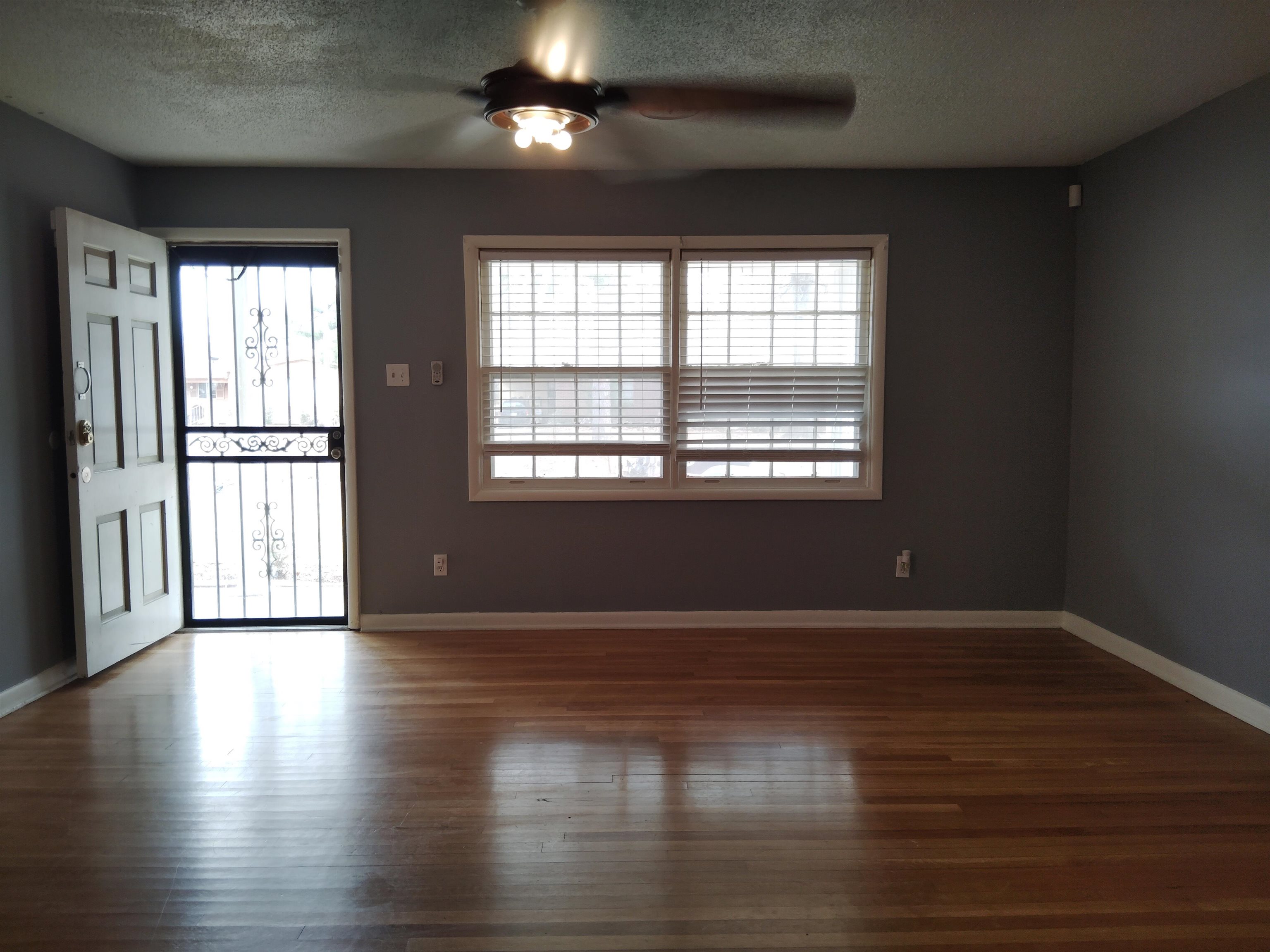 4307 Sidney Road Memphis, TN 38116 - Photo 5 of 18 Spare room with healthy amount of natural light, dark wood finished floors, a textured ceiling, and a ceiling fan