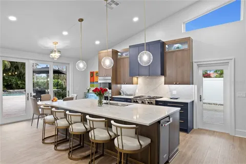 a kitchen with a table and chairs in it