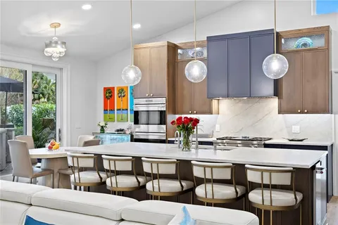 a view of a dining room with furniture and a large window