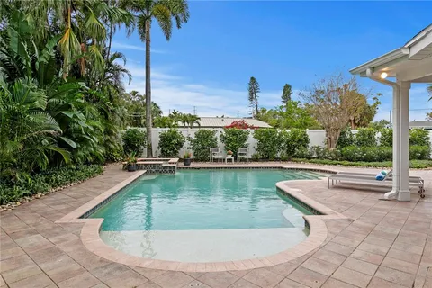 a view of a swimming pool with a patio