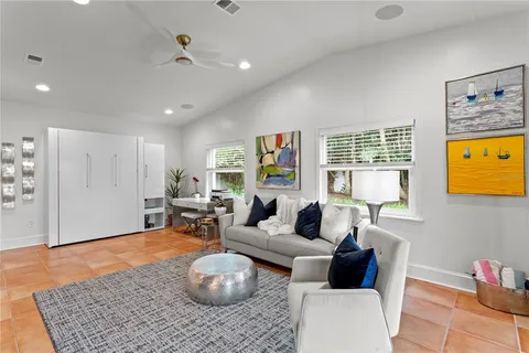 a living room with furniture and a rug