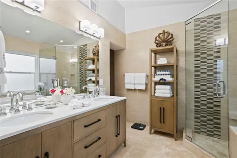 a bathroom with a sink vanity and mirror