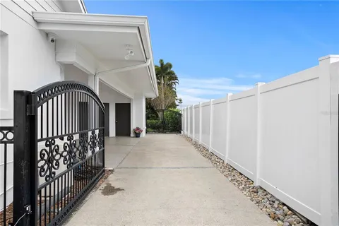 a view of staircase with railing and a potted plant