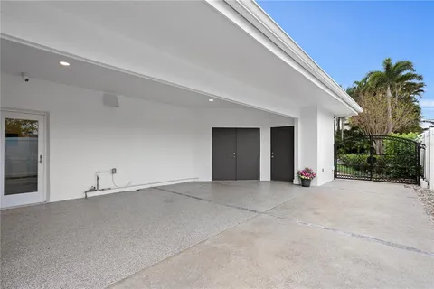 a view of an empty room with a garage