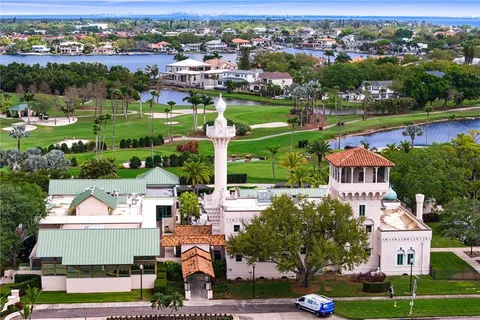an aerial view of a houses with a yard