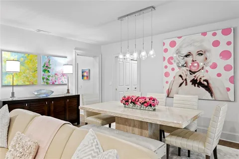 a living room with furniture and flowers