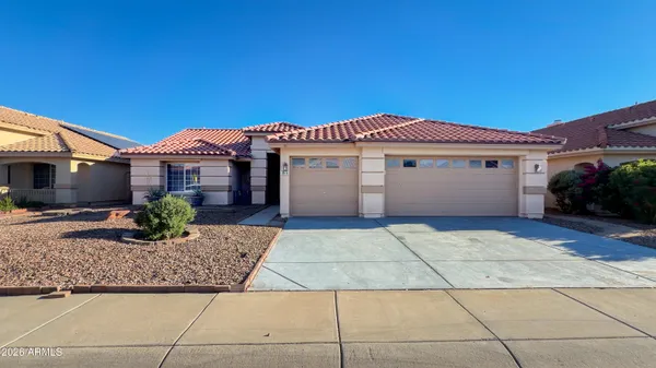 a front view of a house with a garage