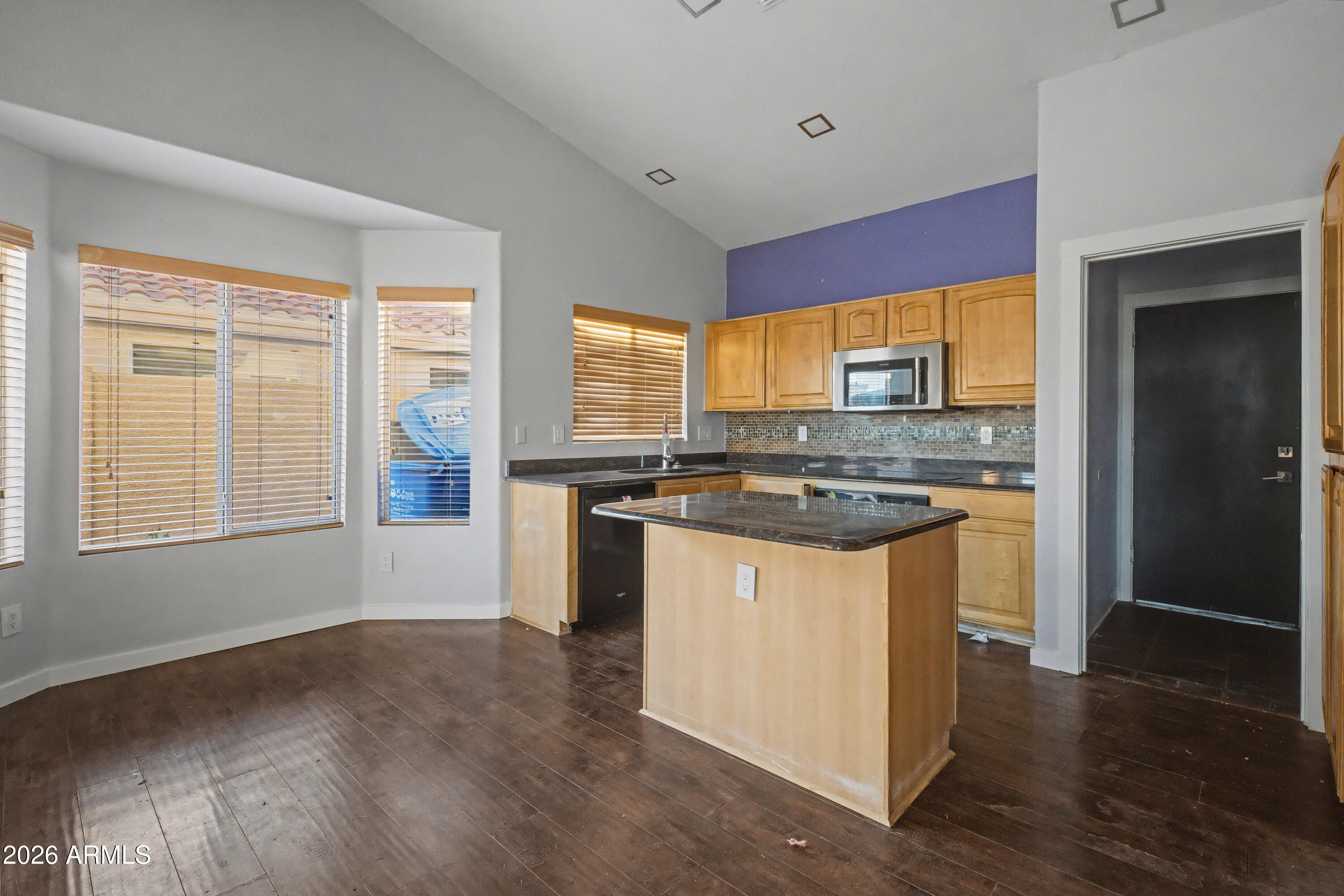 3925 West Charter Oak Road Phoenix, AZ 85029 - Photo 12 of 39 a kitchen with stainless steel appliances granite countertop a stove a sink and a refrigerator