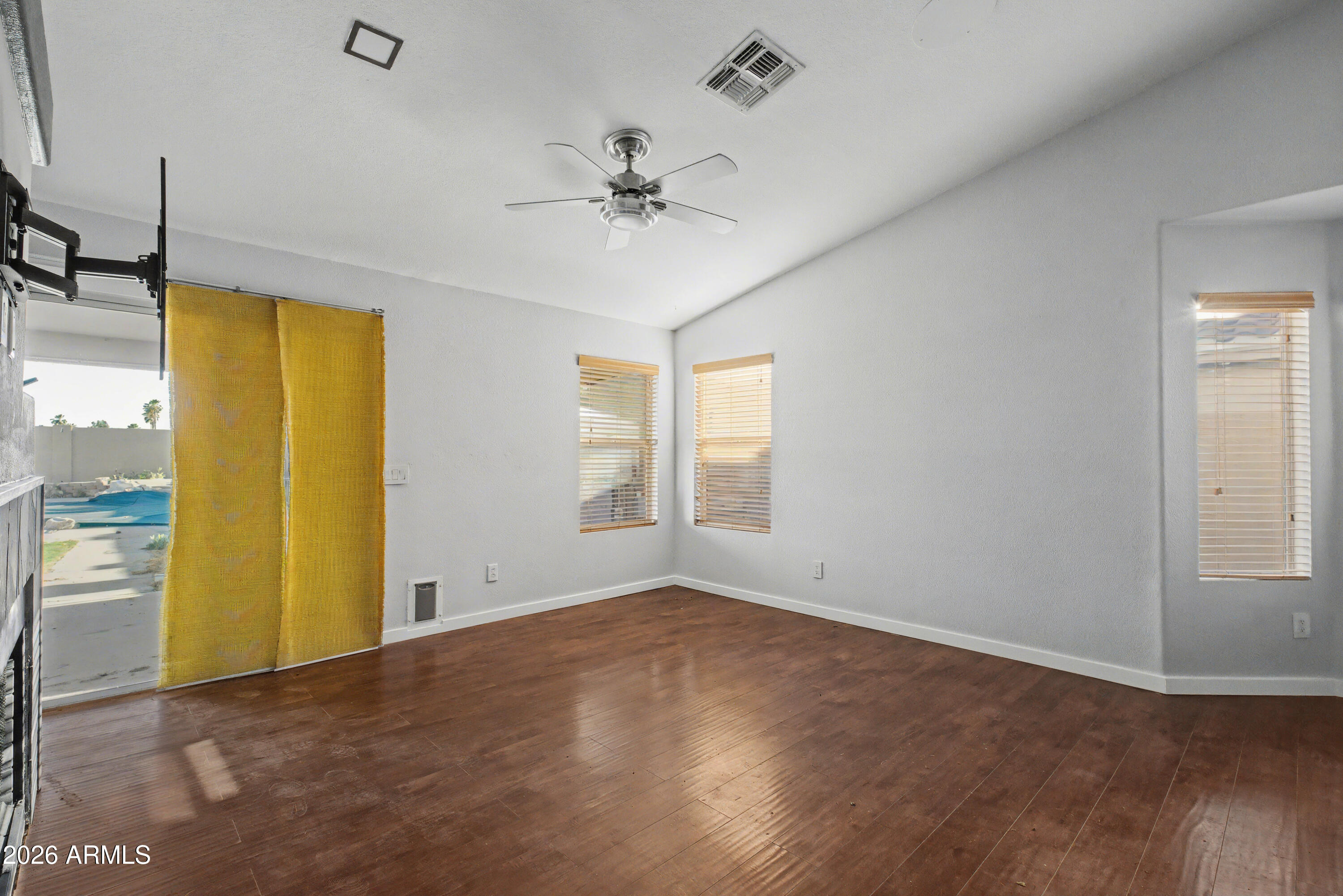 3925 West Charter Oak Road Phoenix, AZ 85029 - Photo 13 of 39 wooden floor in an empty room with a window