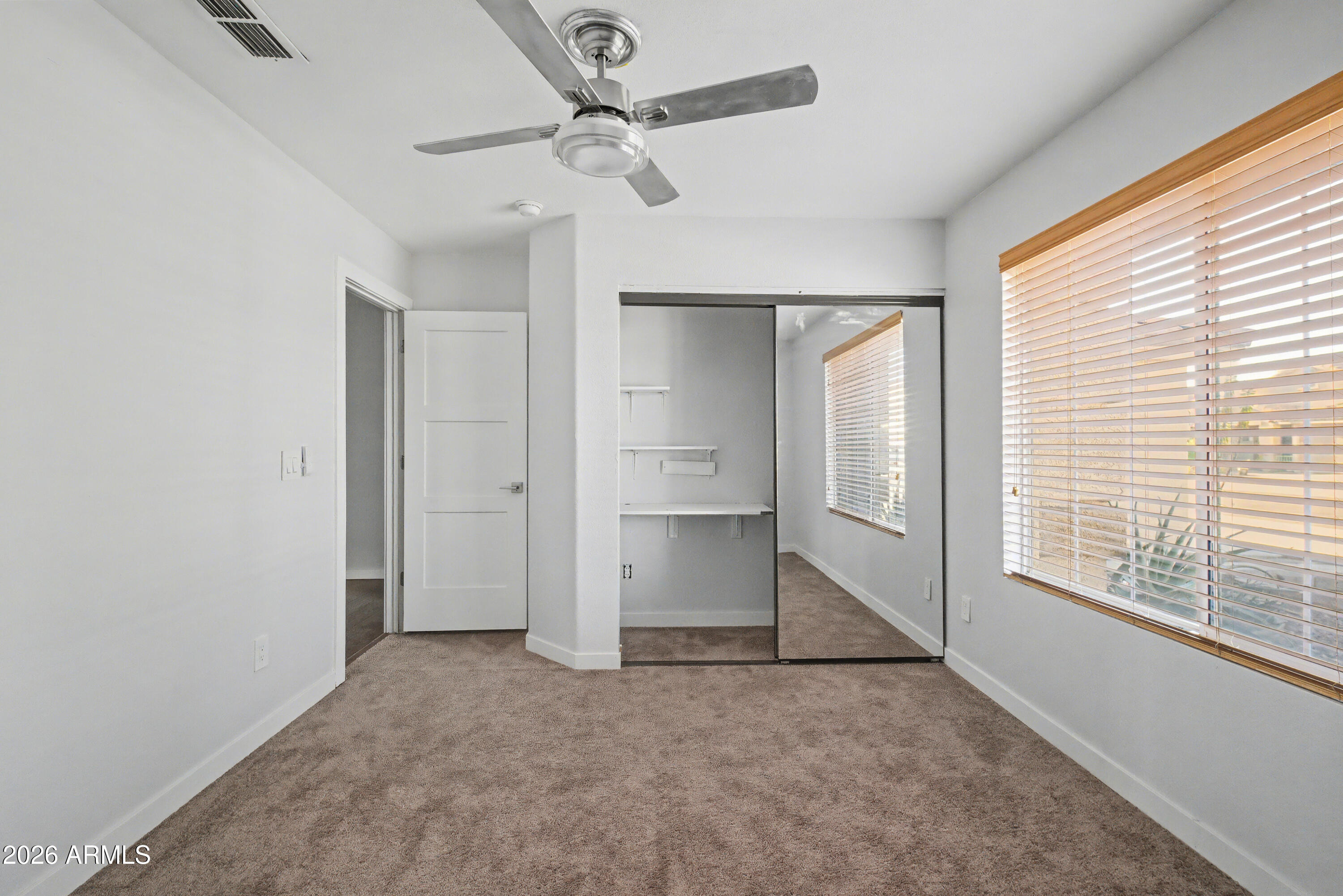 3925 West Charter Oak Road Phoenix, AZ 85029 - Photo 16 of 39 a view of an empty room with a window