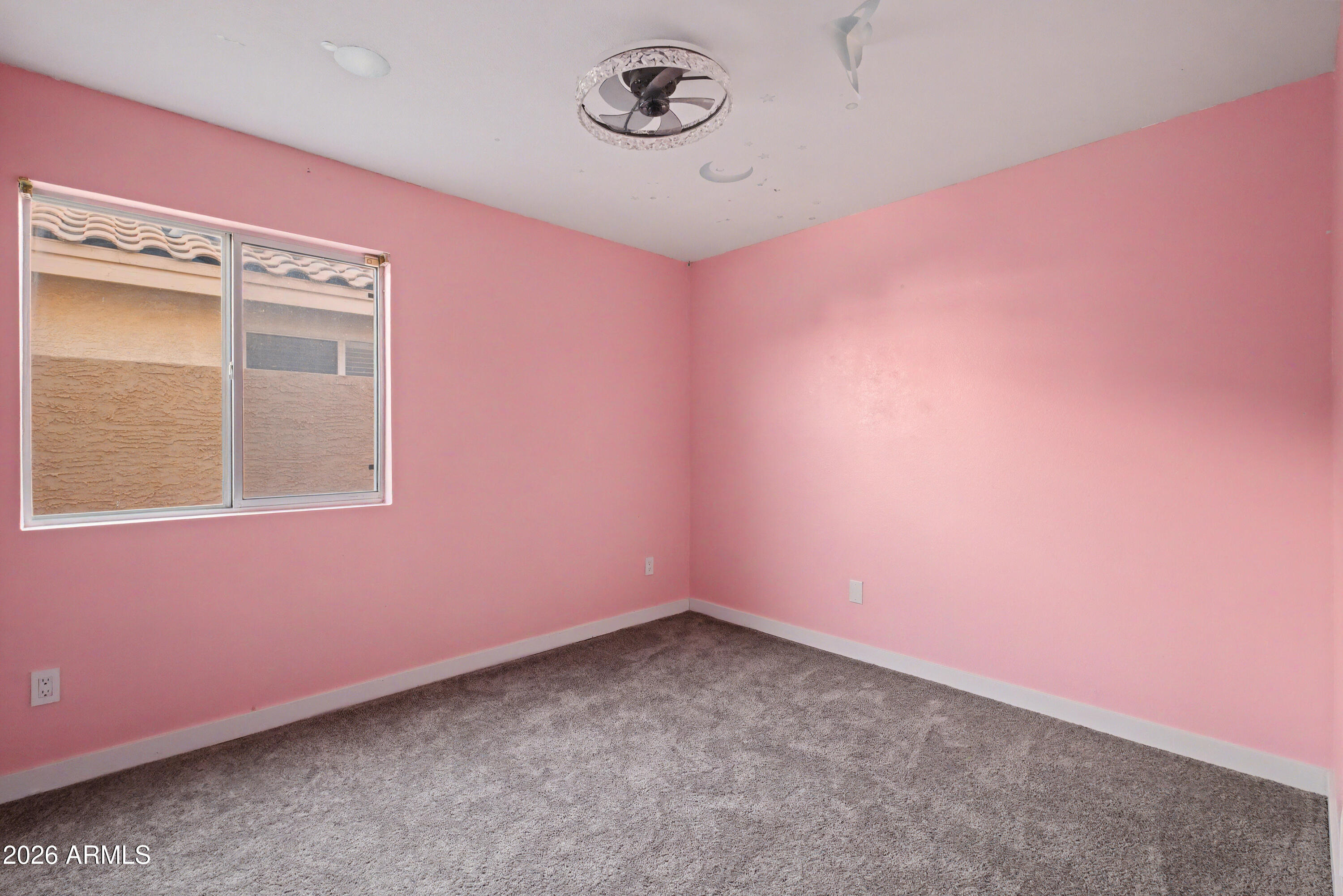 3925 West Charter Oak Road Phoenix, AZ 85029 - Photo 17 of 39 a view of an empty room with a window