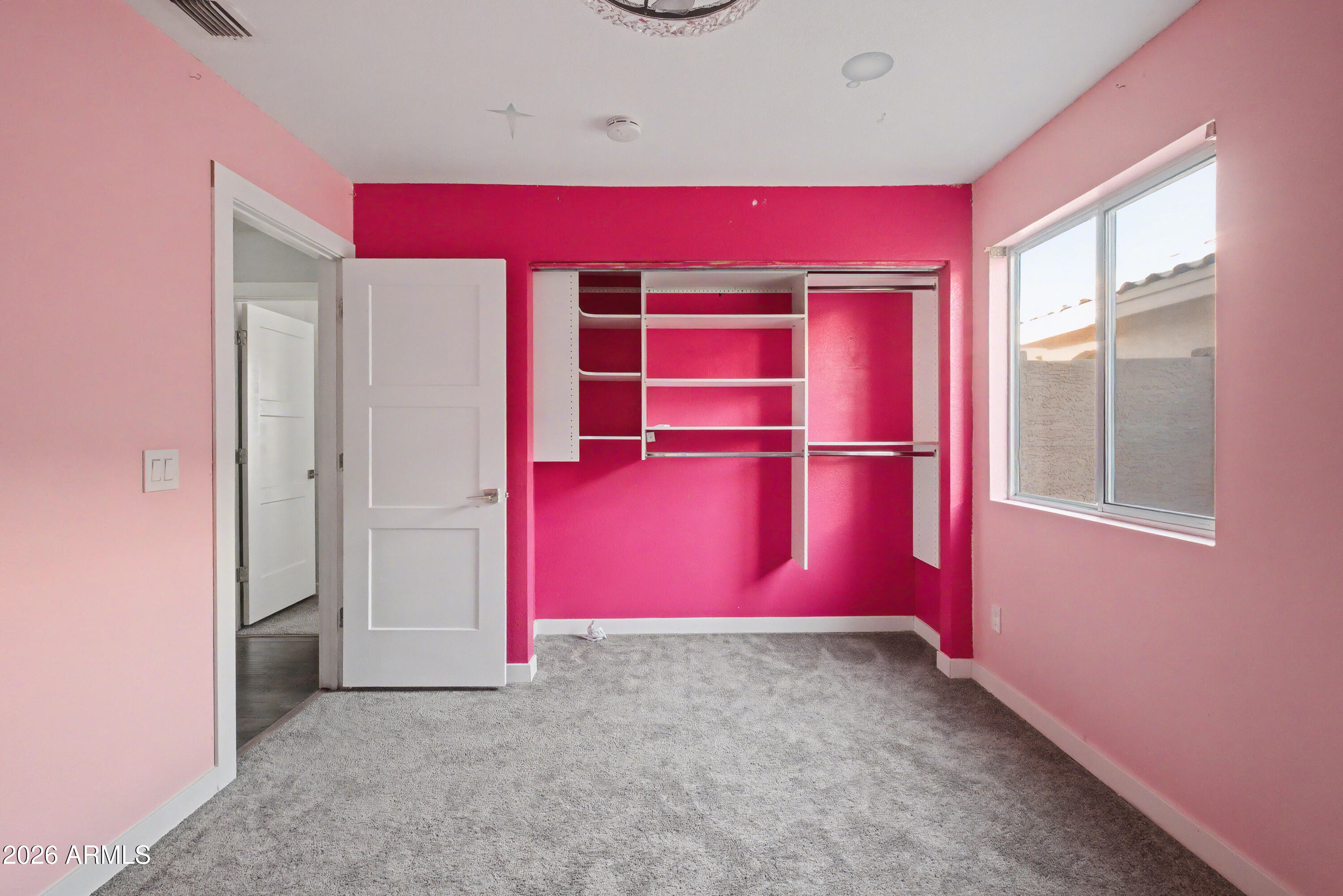 3925 West Charter Oak Road Phoenix, AZ 85029 - Photo 18 of 39 an empty room with red walls