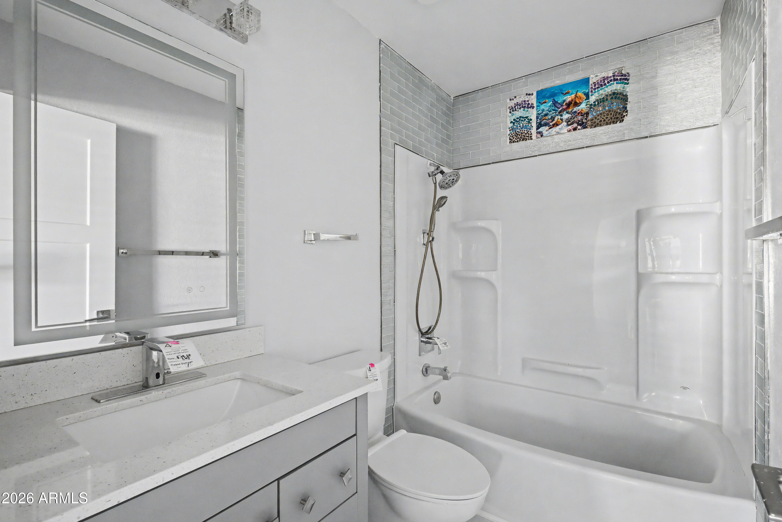 3925 West Charter Oak Road Phoenix, AZ 85029 - Photo 19 of 39 a bathroom with a sink a toilet and a bathtub