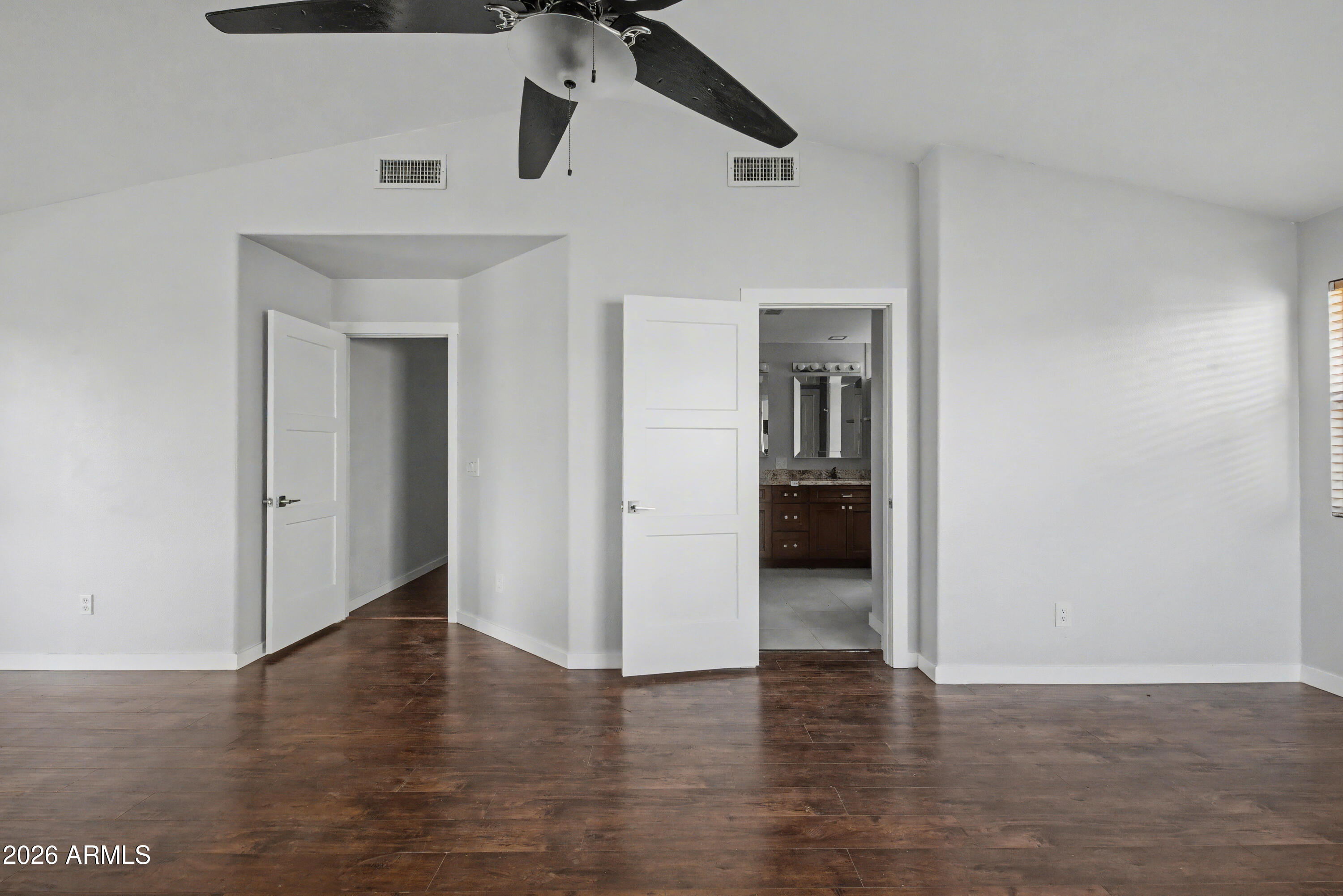 3925 West Charter Oak Road Phoenix, AZ 85029 - Photo 23 of 39 a view of a hallway with wooden floor and a cabinet
