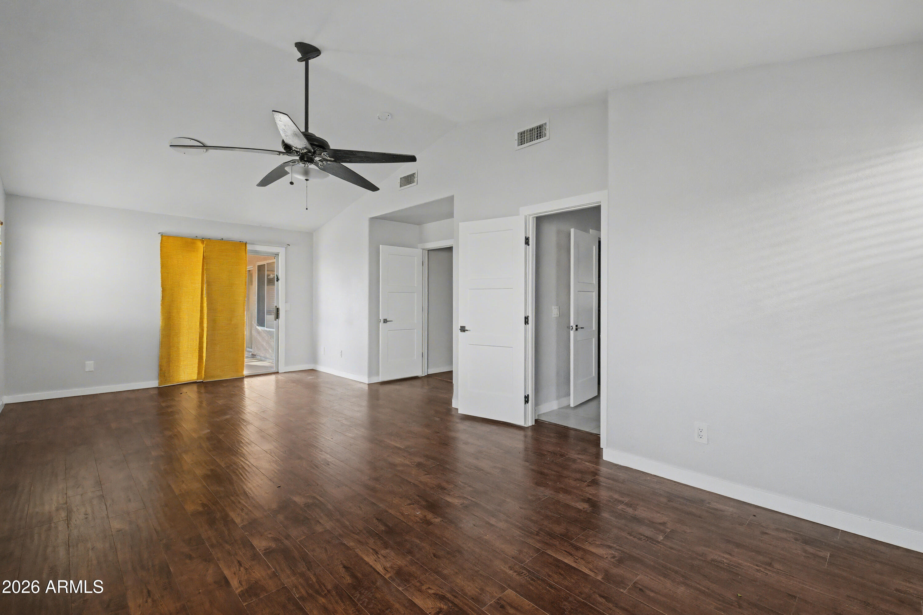3925 West Charter Oak Road Phoenix, AZ 85029 - Photo 24 of 39 a view of empty room with wooden floor and fan