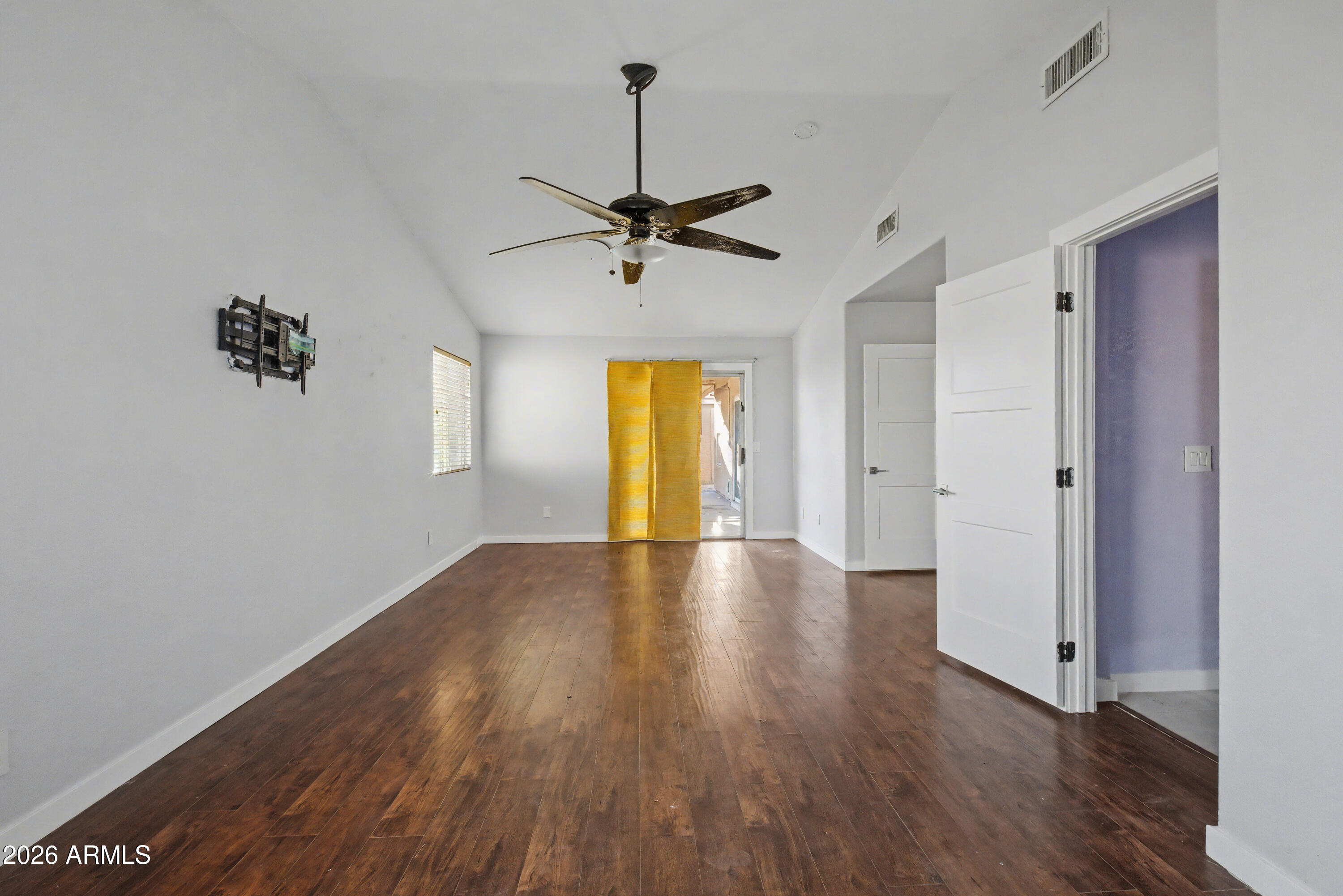 3925 West Charter Oak Road Phoenix, AZ 85029 - Photo 25 of 39 a view of empty room with a window and wooden floor