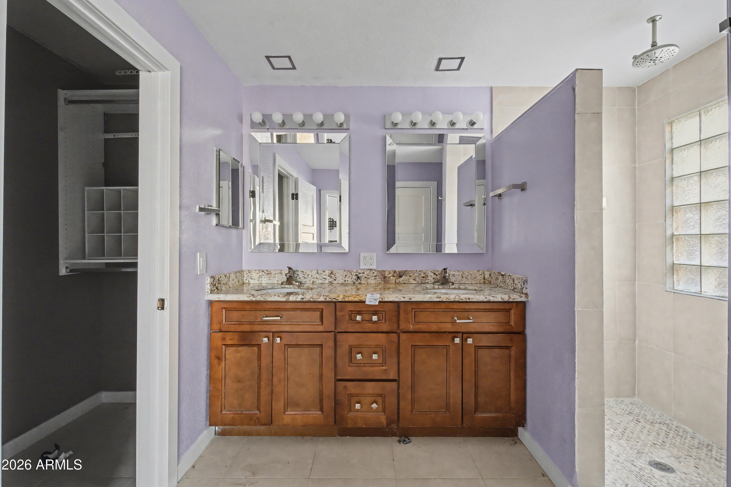 3925 West Charter Oak Road Phoenix, AZ 85029 - Photo 26 of 39 a spacious bathroom with a granite countertop sink a mirror and a shower