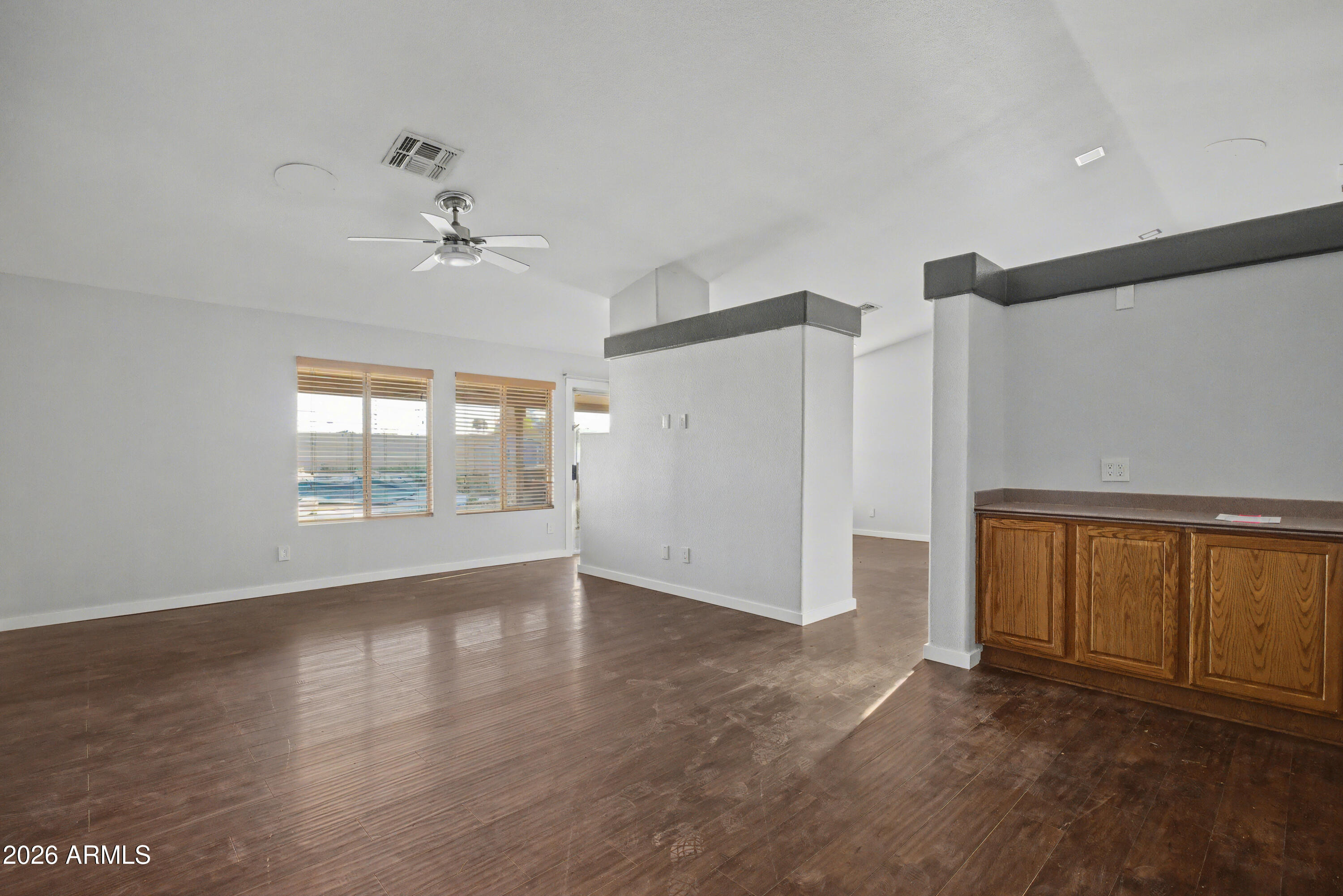 3925 West Charter Oak Road Phoenix, AZ 85029 - Photo 3 of 39 a view of an empty room with a window