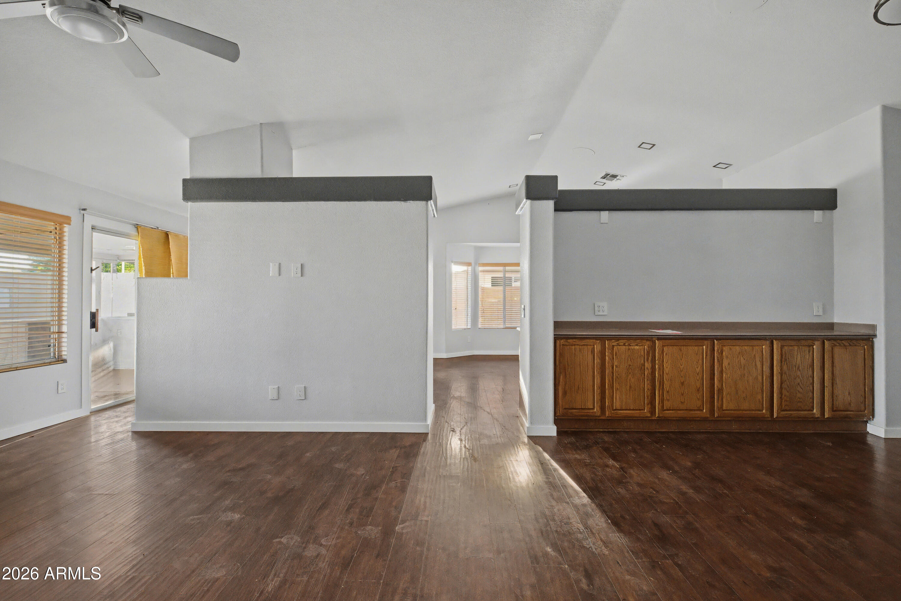3925 West Charter Oak Road Phoenix, AZ 85029 - Photo 4 of 39 a view of an empty room with wooden floor