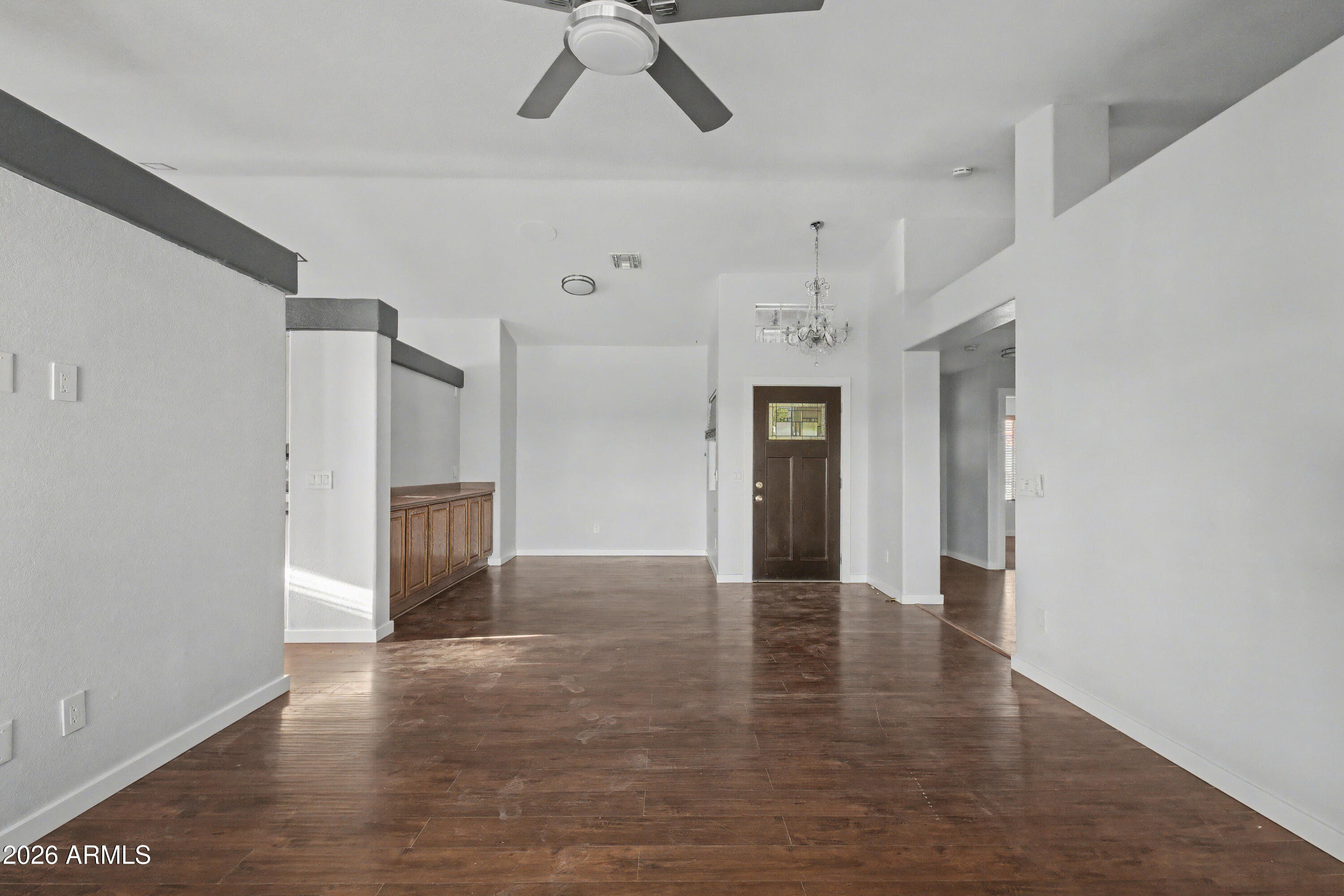3925 West Charter Oak Road Phoenix, AZ 85029 - Photo 6 of 39 a view of an empty room with a window