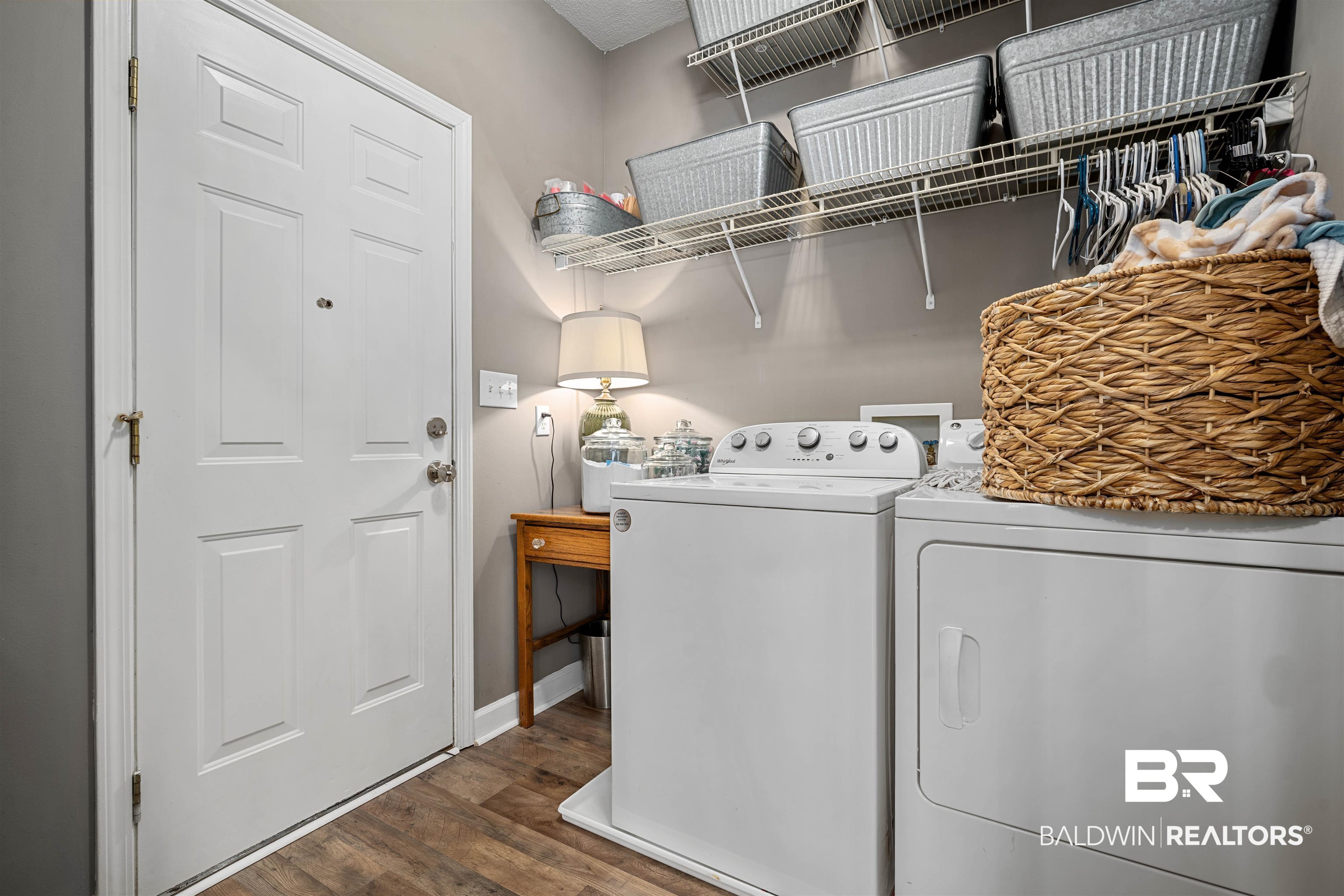 27288 Parker Lane Daphne, AL 36526 - Photo 22 of 29 Washroom with washing machine and clothes dryer and dark wood finished floors