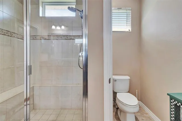 a view of a hallway to rooms and a bathroom