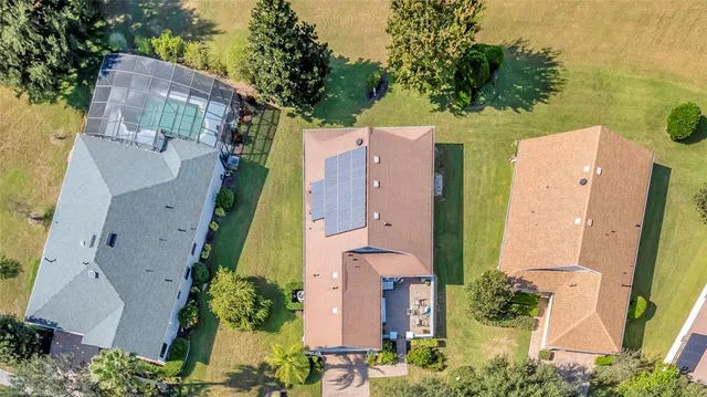 an aerial view of a houses with a lake and lake view