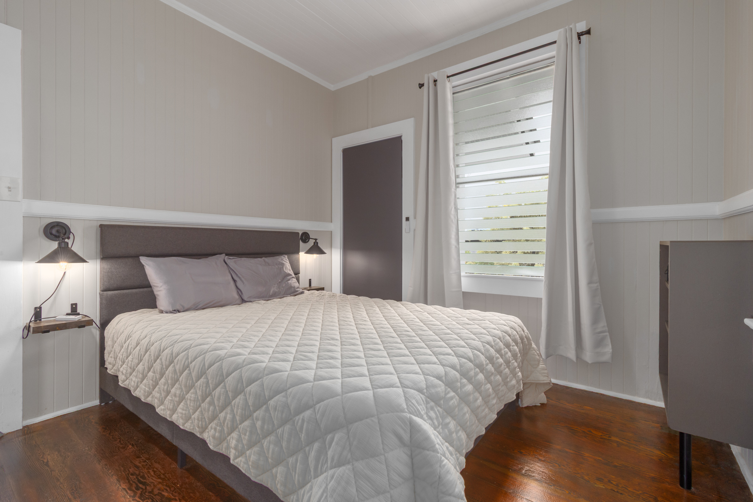 110 Malia Street Hilo, HI 96720 - Photo 11 of 27 a bedroom with a bed and a window