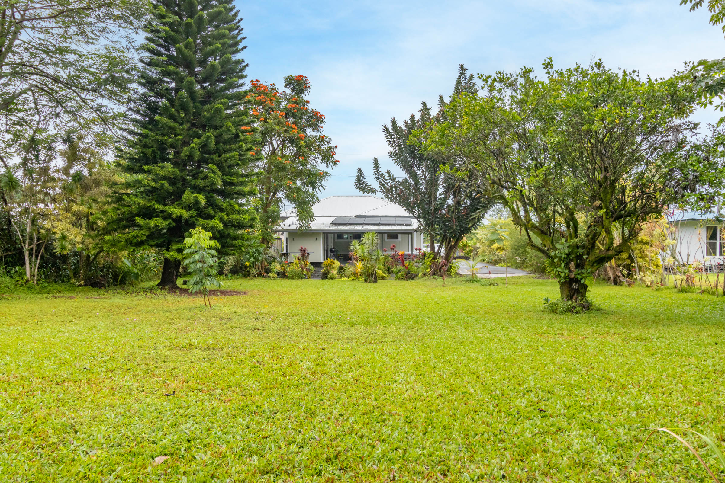 110 Malia Street Hilo, HI 96720 - Photo 22 of 27 a front view of a house with a big yard
