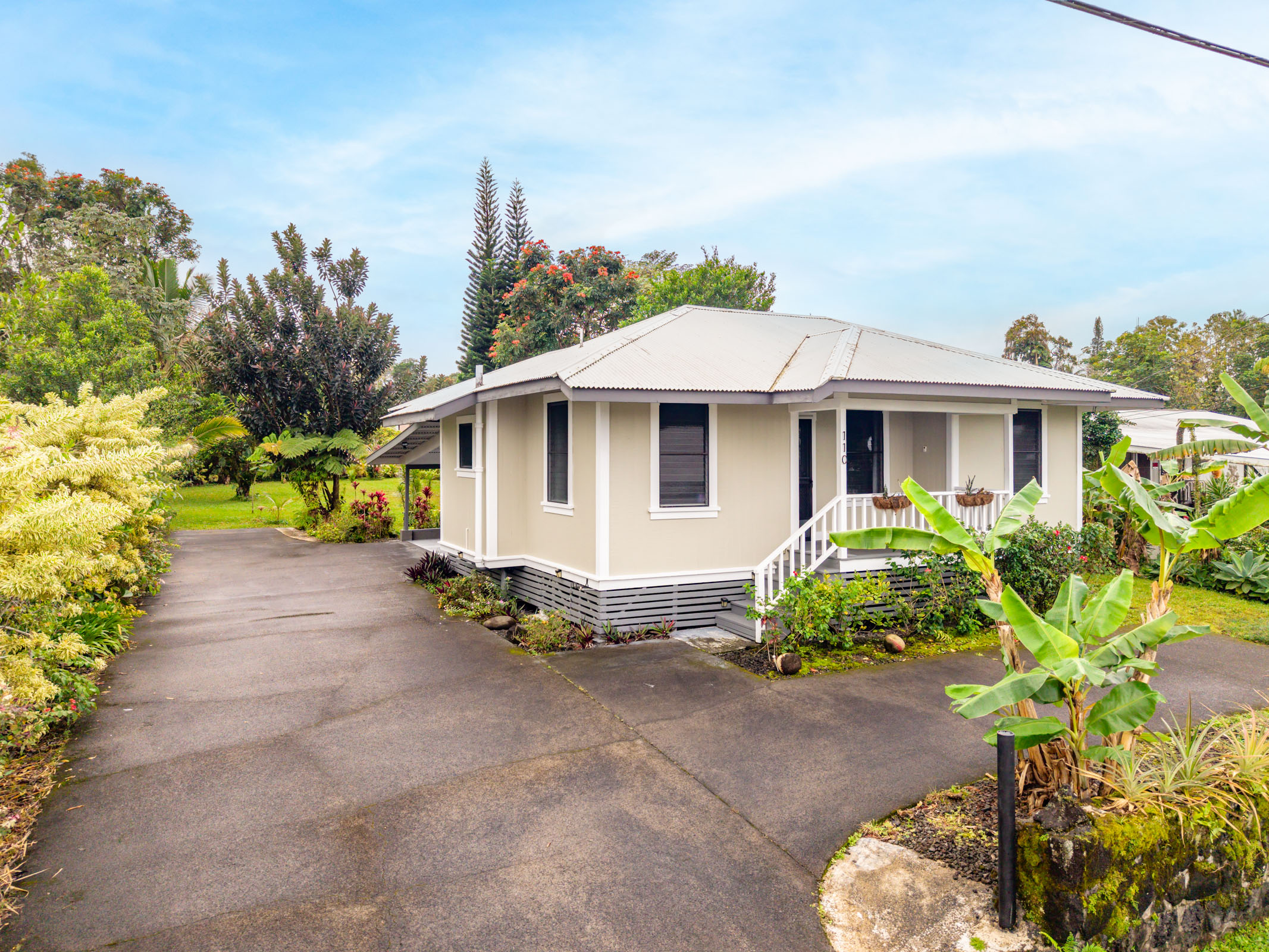 110 Malia Street Hilo, HI 96720 - Photo 27 of 27 a view of a house with a yard and a garden