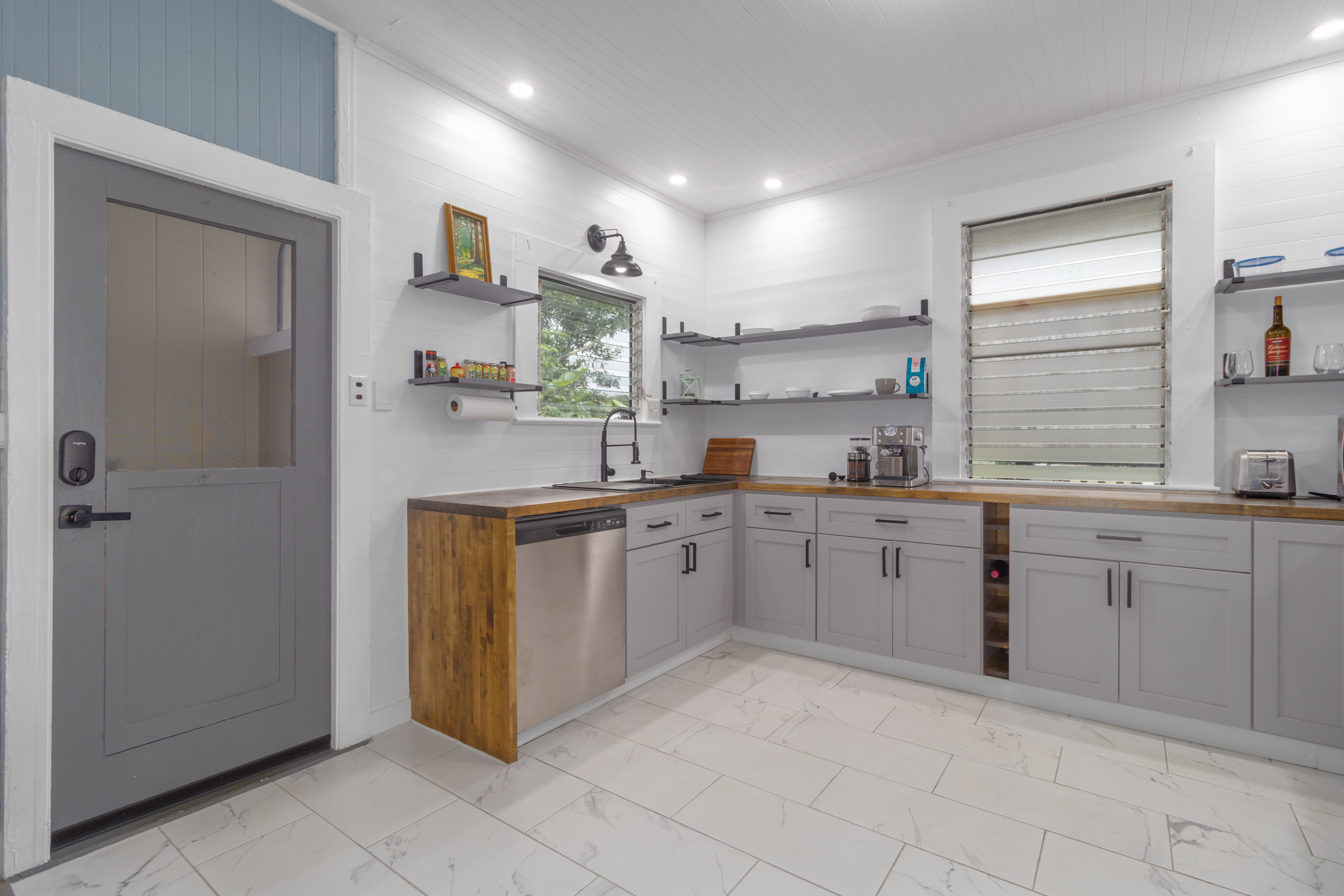 110 Malia Street Hilo, HI 96720 - Photo 10 of 27 a kitchen with cabinets and window