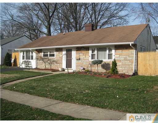 22 Kenmore Road Edison, NJ 08817 - Photo 1 of 11 front view of a house with a yard