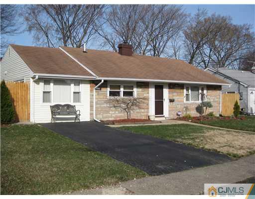 22 Kenmore Road Edison, NJ 08817 - Photo 11 of 11 a front view of a house with a garden