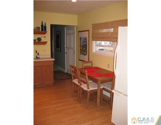 22 Kenmore Road Edison, NJ 08817 - Photo 5 of 11 a room with furniture and wooden floor