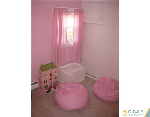 22 Kenmore Road Edison, NJ 08817 - Photo 9 of 11 a bathroom with a sink and toilet