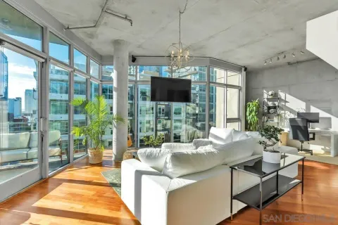a living room with furniture and a flat screen tv